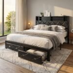 Modern black metal platform bed frame featuring a tufted PU leather headboard with built-in shelves and under-bed storage drawers in a bright, cozy bedroom setting. Manufactured by MMK Furniture Makers.