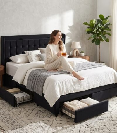 Woman relaxing on a custom black velvet storage bed frame with metal structure and under-bed drawers. Wholesale furniture by MMK Trade Inc.