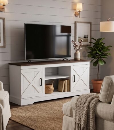 Modern white farmhouse TV stand with a rustic brown wood top and open center shelves in a cozy living room. Manufactured by MMK Furniture Makers for US wholesale and B2B furniture buyers.