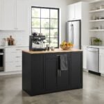 Modern black wooden kitchen trolley with a light wood countertop in a bright kitchen setting. Wholesale custom kitchen furniture manufactured by MMK Furniture Makers.