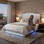 Lifestyle application of a custom white tufted LED bed frame featuring a person relaxing, showcasing premium velvet and MDF construction by OEM furniture supplier MMK TRADE INC.