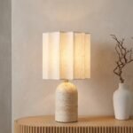 Wholesale modern travertine table lamp with pleated fabric shade by MMK Furniture Makers styled on an oak console table