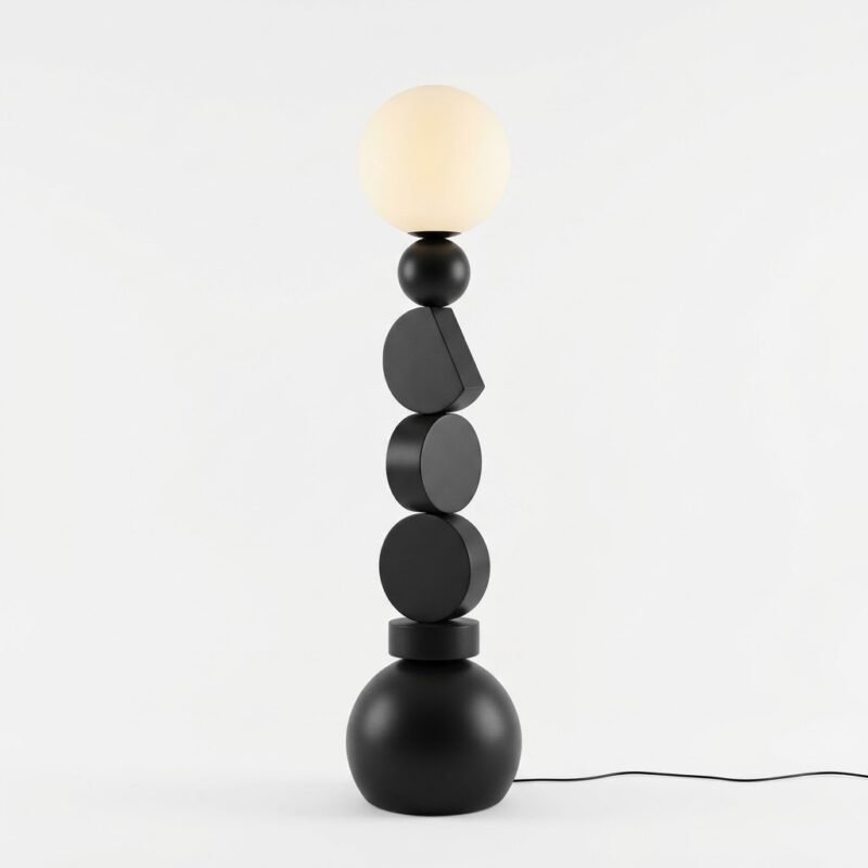 A-full-view-clean-architectural-studio-shot-of-the-stacked-geometric-floor-lamp-showing-its-unique-black-shapes-and-spherical-shade-in-a-light-filled-minimalist-room.