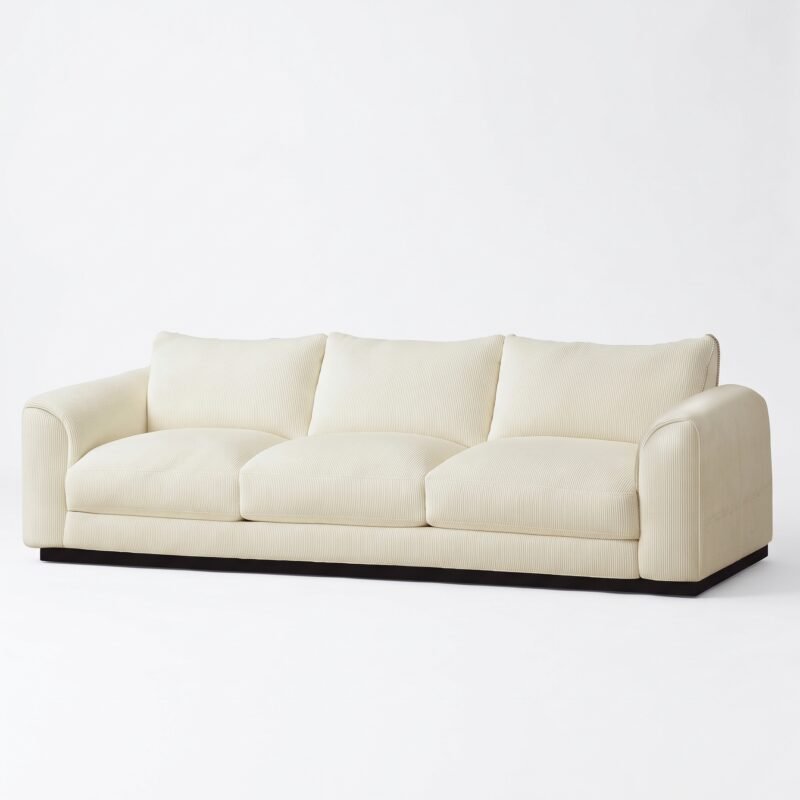 1.Front-view-of-a-luxurious-modern-cream-3-seater-sofa-with-a-dark-wood-base-isolated-on-a-clean-white-background-manufactured-by-MMK-Furniture-Makers.
