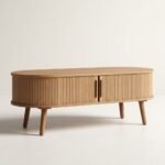 Modern-oval-fluted-solid-oak-coffee-table-with-sliding-tambour-doors-on-tapered-legs.