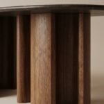 Close-up-of-intricate-fluted-walnut-wood-grain-on-a-table-base-showing-different-flute-diameters.