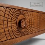 Close-up-of-the-sunburst-carved-drawer-front-on-the-oak-table