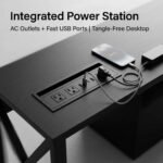 Desktop-close-up-showing-recessed-power-outlets-and-USB-ports-charging-devices.