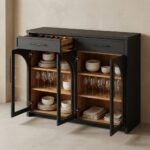 Open-view-of-arched-storage-cabinet-showing-oak-shelves-and-drawers.