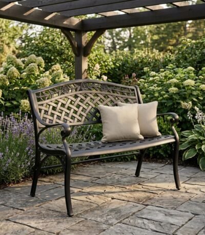 The-cast-aluminum-patio-bench-in-a-landscaped-garden-patio-setting.