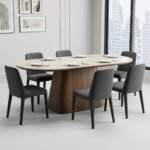 The-stone-and-walnut-table-set-with-chairs-in-a-contemporary-showroom.