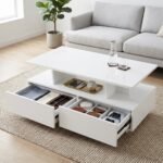 .White-coffee-table-featuring-dual-smooth-glide-drawers-and-open-central-storage-shelf.