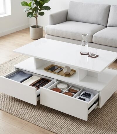 .White-coffee-table-featuring-dual-smooth-glide-drawers-and-open-central-storage-shelf.