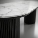 Macro-close-up-shot-focusing-on-the-high-quality-wood-fluting-and-marble-top-texture.