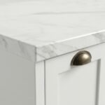 Close-up-of-faux-marble-top-and-antique-bronze-hardware.