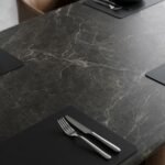 Detail-shot-of-dark-faux-stone-table-top-veining-and-edge-finish.
