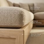 3.Macro-close-up-shot-highlighting-heavy-duty-textured-faux-linen-upholstery-French-piping-seams-and-natural-solid-ash-wood-base
