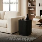 Modern-black-fluted-side-table-beside-luxury-fabric-sofa-in-living-room.