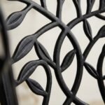 Close-up-of-intricate-cast-aluminum-backrest-pattern.