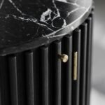 Close-up-of-black-marble-tabletop-and-red-oak-fluted-wood-craftsmanship.