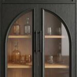 Detail-shot-of-arched-glass-doors-with-black-oak-wood-frame.