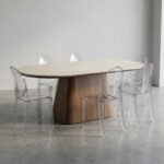 The-table-with-four-transparent-chairs-demonstrating-seating-capacity.