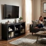 Custom black engineered wood TV stand with open shelving in a modern living room setting by MMK Furniture Makers