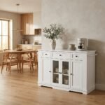 Freestanding white kitchen island storage cabinet featuring 3 drawers and tempered glass doors in a bright modern home by MMK Furniture Makers