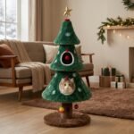Green plush Christmas tree cat condo tower featuring dual hideaway condos in a cozy modern living room by MMK Furniture Makers.