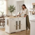 Woman using white kitchen storage sideboard cabinet with towel bars in modern open-concept kitchen by MMK Trade Inc